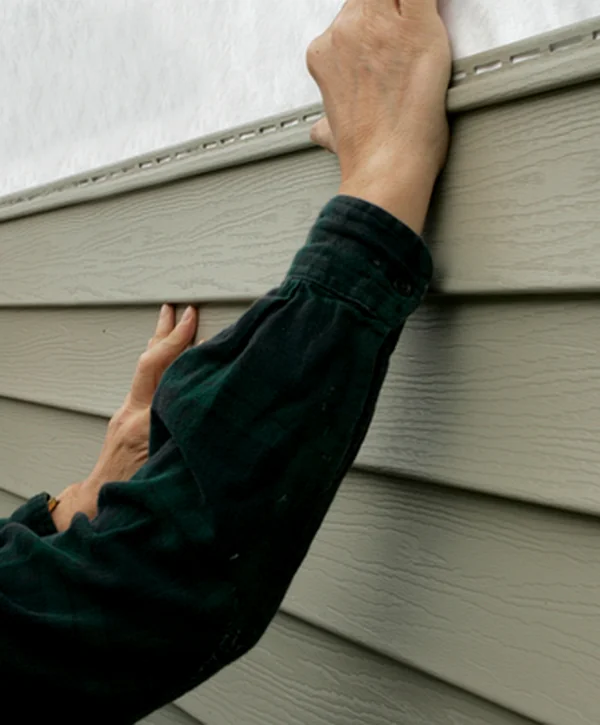 siding installation gretna ne siding professional contractors expertly installing beige vinyl siding with precision craftsmanship
