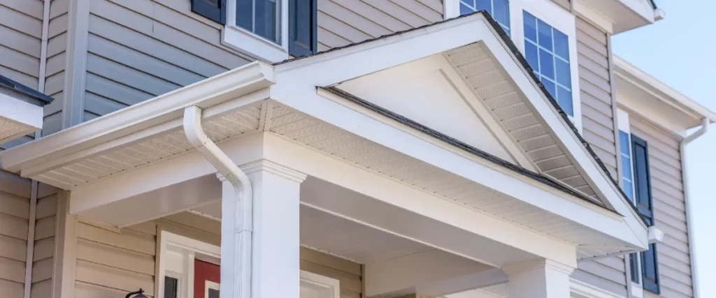 the exterior of a home, featuring siding and a portico