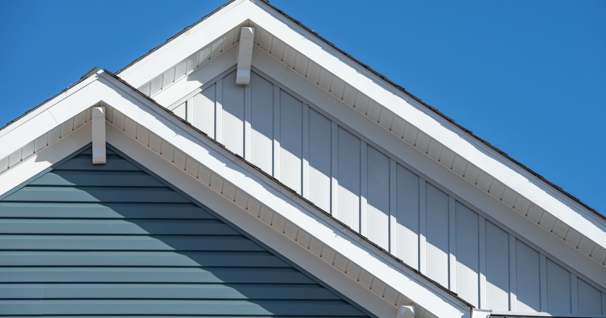 A professional installation of James Hardie Backer Board on a shower wall showing the cement board texture and grid pattern for tile prep.